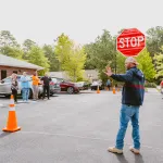 flagger instructor holding stop sign 