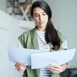 woman reviewing papers