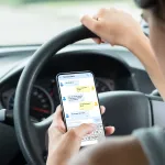 photo of person texting while driving
